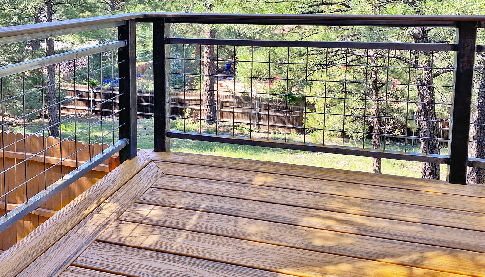 Trex deck with custom welded guardrail.  Decking color is Havana Gold