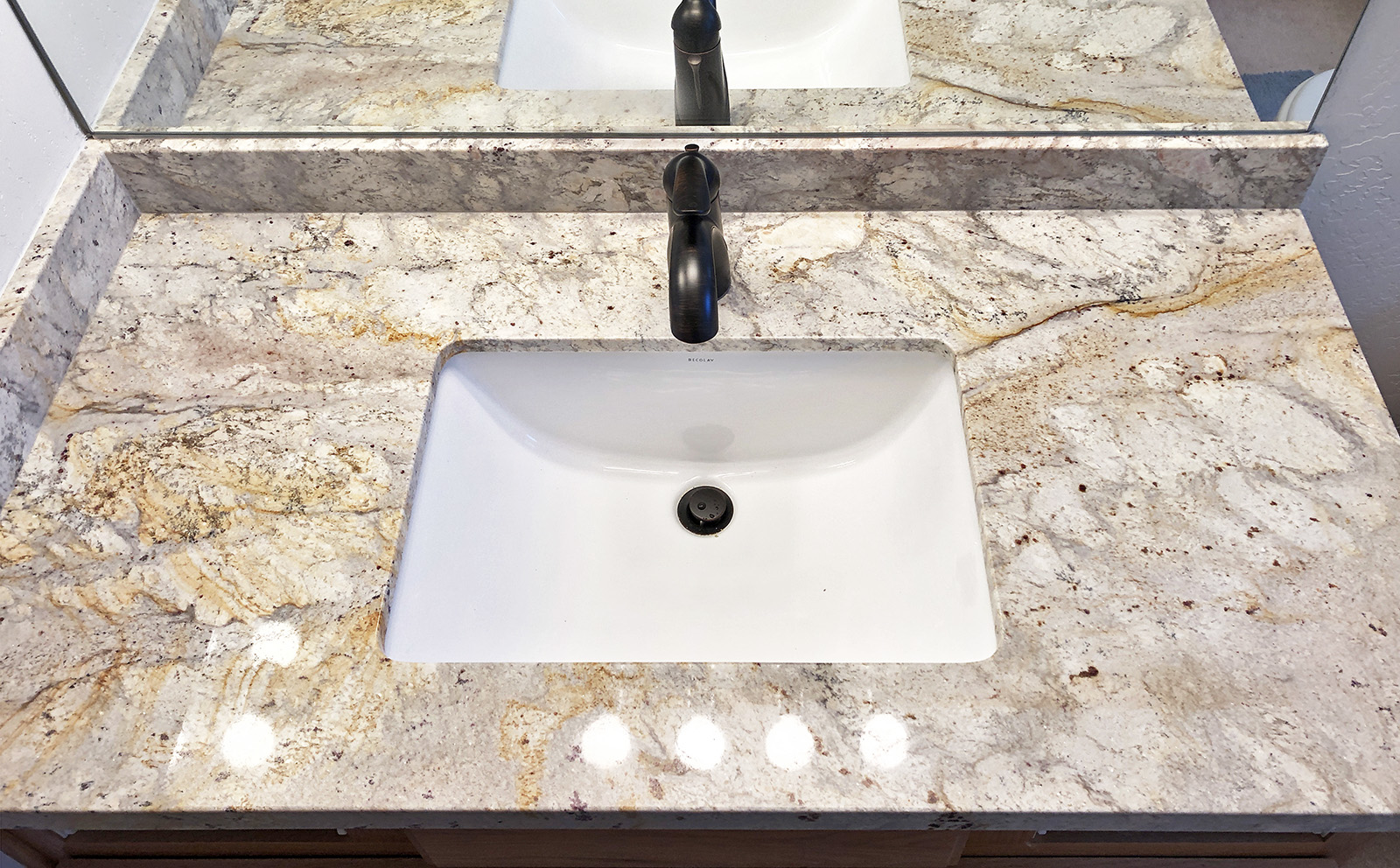granite countertop with undermount sink and oil rubbed bronze single handle faucet