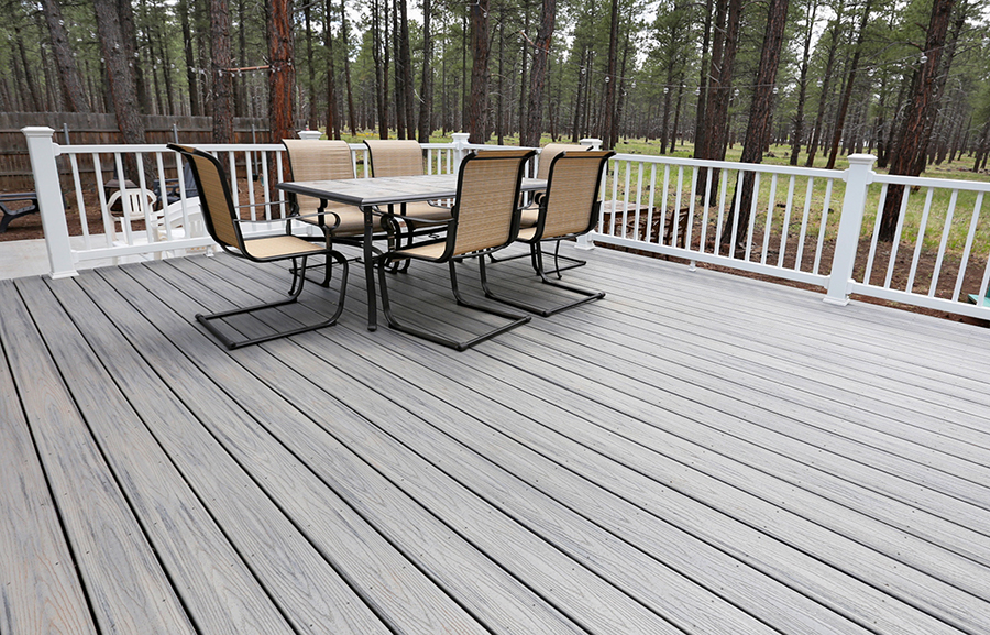 Trex Transcends Decking in Island Mist color with Trex Select White Handrails for a deck in Flagstaff AZ