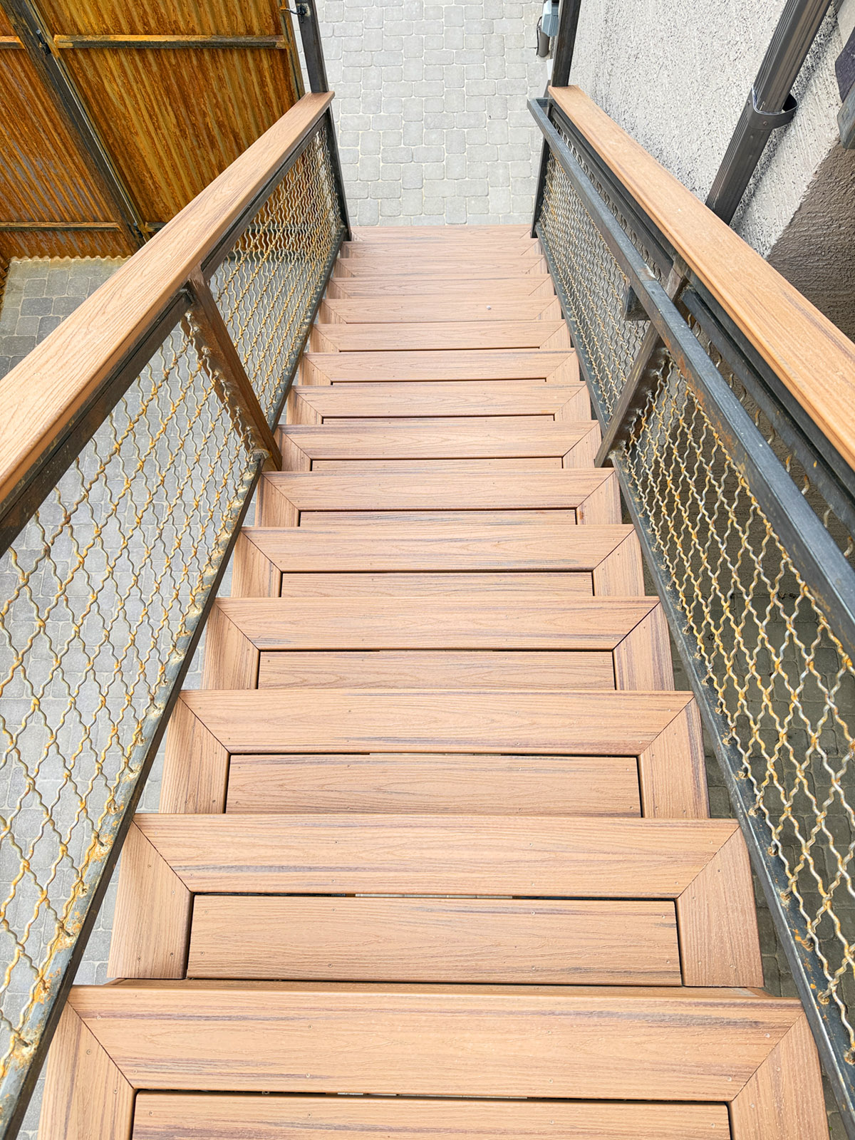 Trex Stairs with rusted railing Deck stairs made with pictured framed steps and a rusted metal railing. Trex composite deck boards.