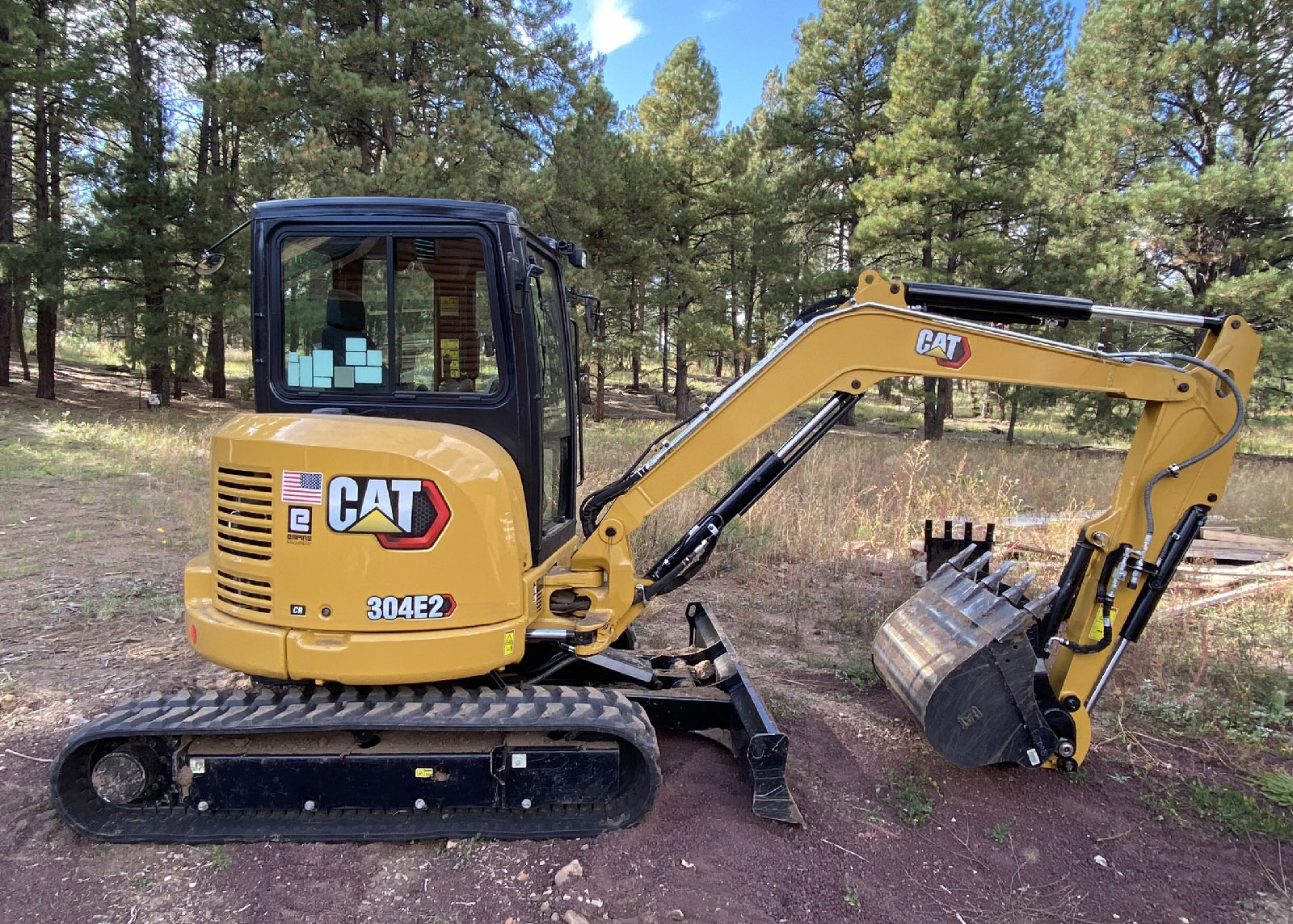 CAT 304E2 Excavator with bucket and thumb