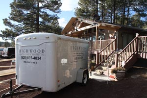 Carpentry tool trailer for Highwood Construction and Remodeling in front of deck cover job