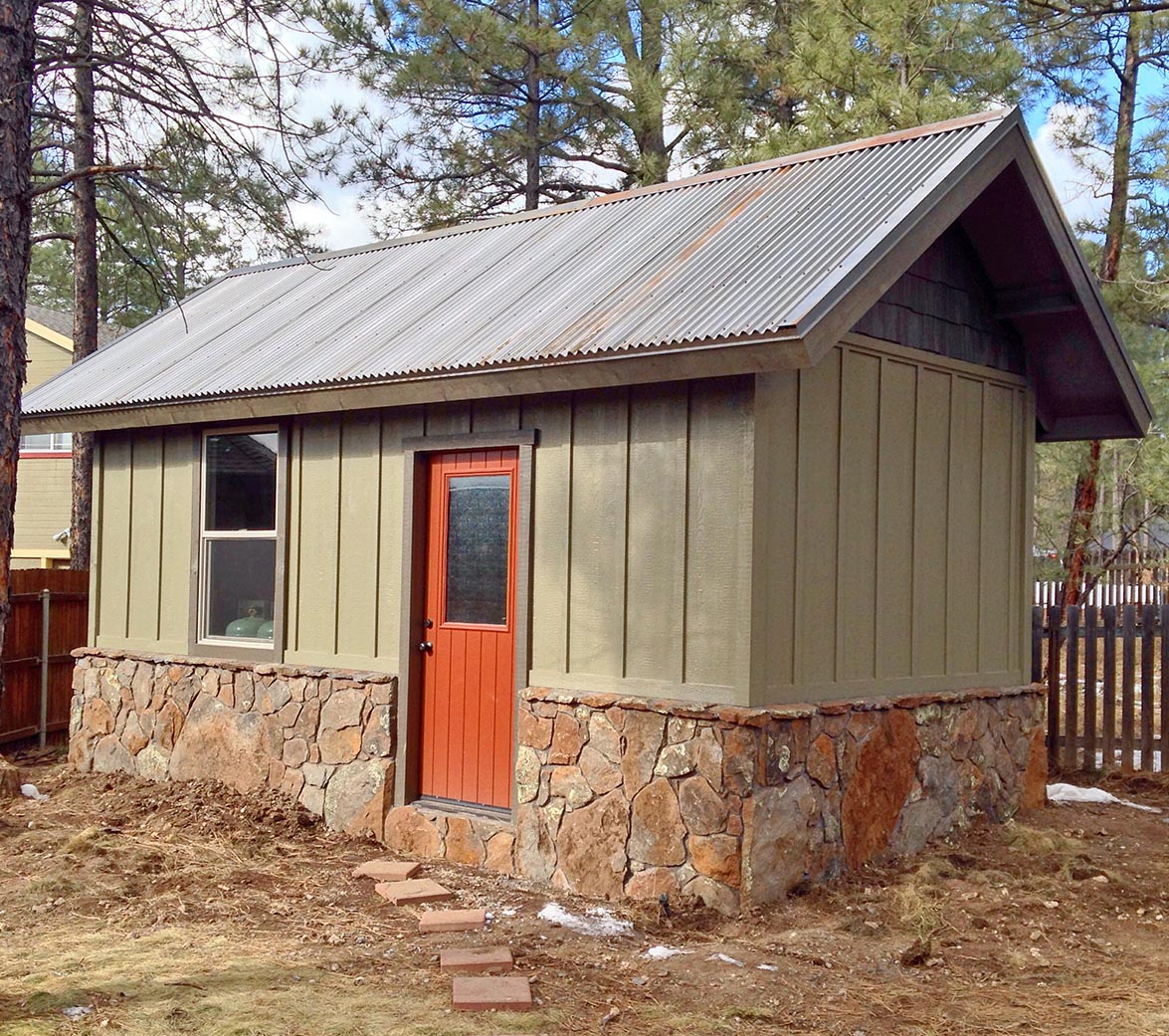 Custom workshop by Highwood construction with a core-ten metal roof.